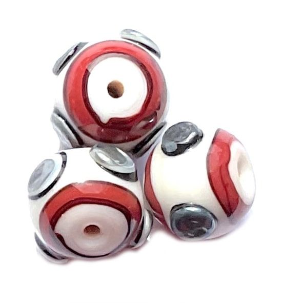 GL6839 12mm Garnet Round With Band & Silvery Spots